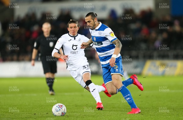 110220 - Swansea City v Queens Park Rangers, Sky Bet Championship - Geoff Cameron of Queens Park Rangers takes on Conor Gallagher of Swansea City