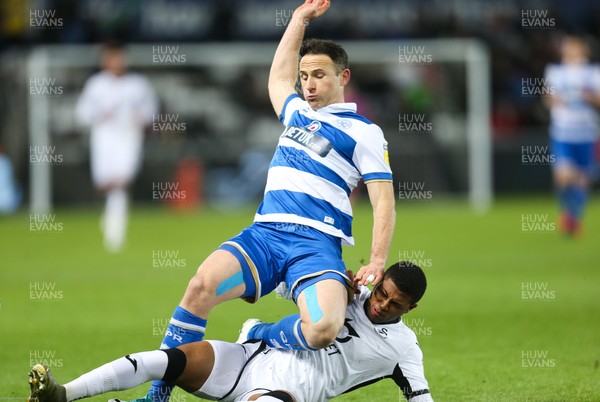 110220 - Swansea City v Queens Park Rangers, Sky Bet Championship - Marc Pugh of Queens Park Rangers is tackled by Rhian Brewster of Swansea City