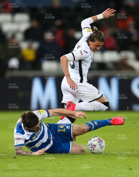 110220 - Swansea City v Queens Park Rangers, Sky Bet Championship - Conor Gallagher of Swansea City and Ryan Manning of Queens Park Rangers compete for the ball