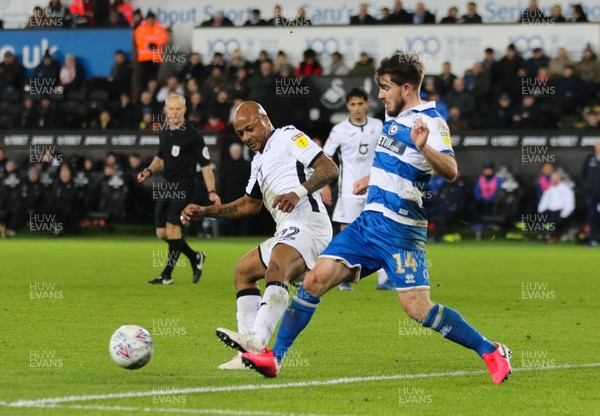 110220 - Swansea City v Queens Park Rangers, Sky Bet Championship - Ryan Manning of Queens Park Rangers is tackled by Andre Ayew of Swansea City