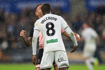 221025 - Swansea City v Queens Park Rangers - Sky Bet Championship - Malick Yalcouye of Swansea City clashes with Steve Cook of Queens Park Rangers