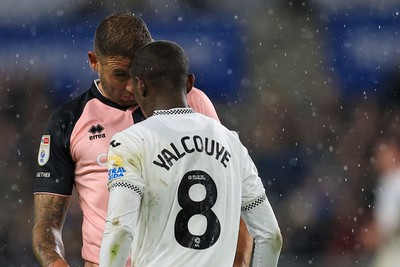 221025 - Swansea City v Queens Park Rangers - Sky Bet Championship -  Malick Yalcouye of Swansea City clashes with Steve Cook of Queens Park Rangers