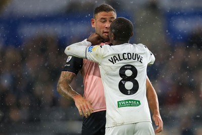 221025 - Swansea City v Queens Park Rangers - Sky Bet Championship -  Malick Yalcouye of Swansea City clashes with Steve Cook of Queens Park Rangers