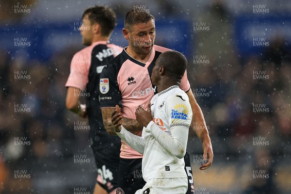 221025 - Swansea City v Queens Park Rangers - Sky Bet Championship -  Malick Yalcouye of Swansea City clashes with Steve Cook of Queens Park Rangers