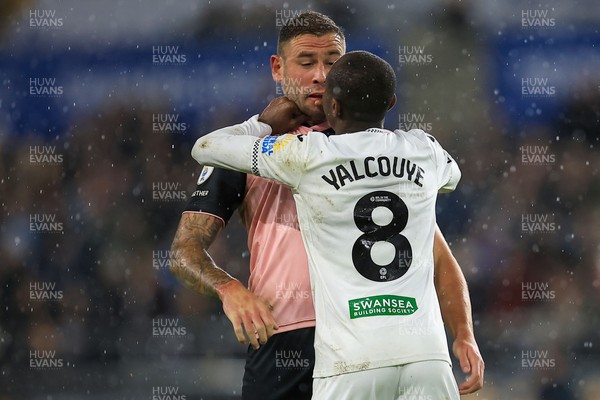 221025 - Swansea City v Queens Park Rangers - Sky Bet Championship -  Malick Yalcouye of Swansea City clashes with Steve Cook of Queens Park Rangers