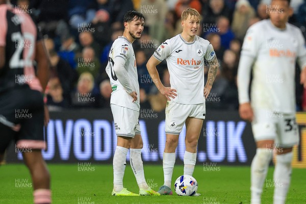 221025 - Swansea City v Queens Park Rangers - Sky Bet Championship - Melker Widell of Swansea City and Liam Cullen of Swansea City