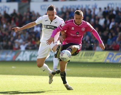 290918 - Swansea City v Queens Park Rangers - SkyBet Championship - Connor Roberts of Swansea City is challenged by Luke Freeman of Queens Park Rangers