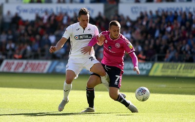 290918 - Swansea City v Queens Park Rangers - SkyBet Championship - Connor Roberts of Swansea City is challenged by Luke Freeman of Queens Park Rangers