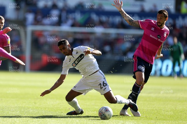 290918 - Swansea City v Queens Park Rangers - SkyBet Championship - Kyle Naughton of Swansea City is tackled by Geoff Cameron of Queens Park Rangers