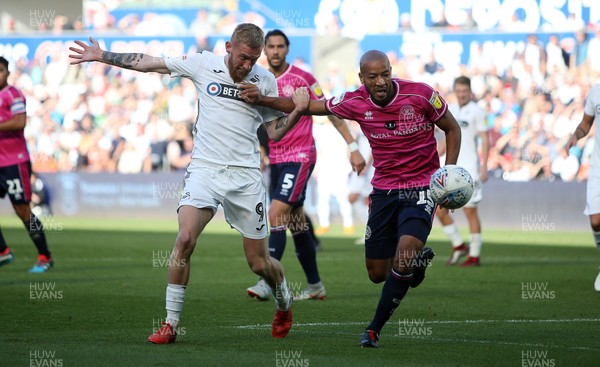 290918 - Swansea City v Queens Park Rangers - SkyBet Championship - Alex John-Baptiste of Queens Park Rangers is challenged by Oli McBurnie of Swansea City