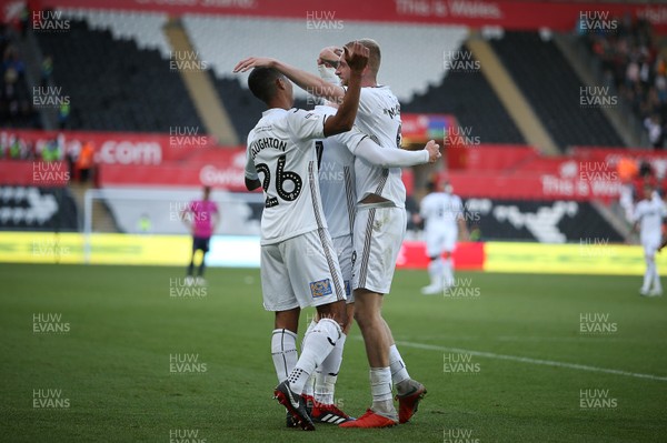 290918 - Swansea City v Queens Park Rangers - SkyBet Championship - Jay Fulton of Swansea City celebrates scoring a goal with Kyle Naughton and Oli McBurnie
