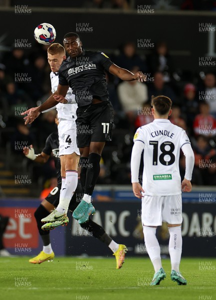 181022 - Swansea City v Reading - SkyBet Championship - Jay Fulton of Swansea City and Yakou Meite of Reading go up for the ball
