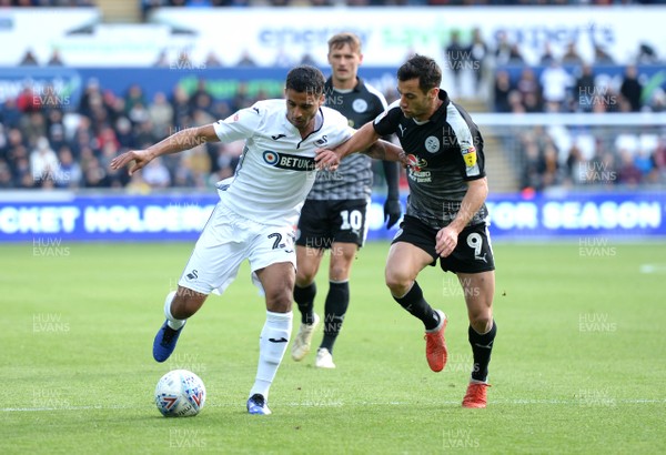 271018 - Swansea City v Reading - SkyBet Championship - Kyle Naughton of Swansea City is tackled by Sam Baldock of Reading