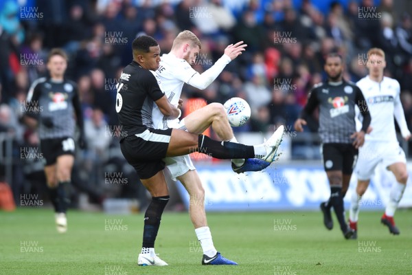 271018 - Swansea City v Reading - SkyBet Championship - Oli McBurnie of Swansea City is tackled by Liam Moore of Reading