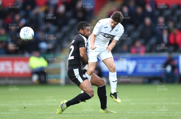 271018 - Swansea City v Reading - SkyBet Championship - Dan James of Swansea City is tackled by Gareth McCleary of Reading