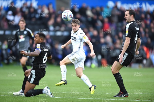 271018 - Swansea City v Reading - SkyBet Championship - Dan James of Swansea City shot is blocked by Liam Moore of Reading