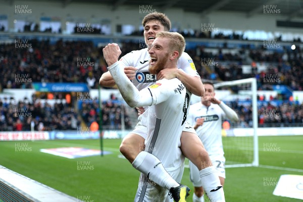 271018 - Swansea City v Reading - SkyBet Championship - Oli McBurnie of Swansea City celebrates scoring his second goal with Dan James (left)