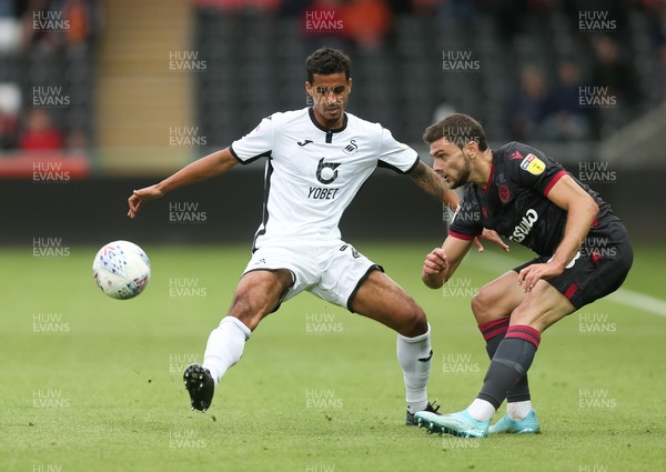 280919 - Swansea City v Reading, SkyBet Championship - Kyle Naughton of Swansea City and Lucas Boye of Reading compete for the ball