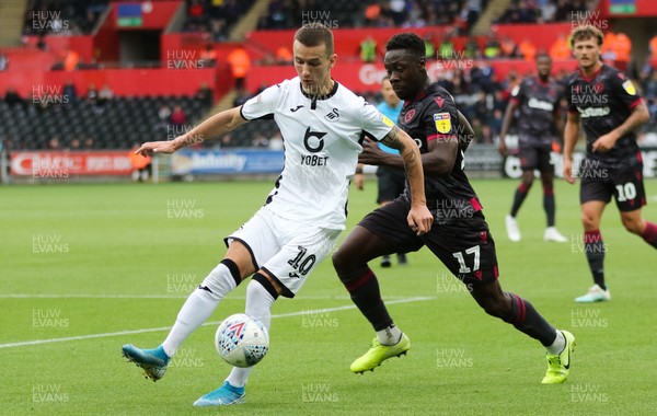 280919 - Swansea City v Reading, SkyBet Championship - Bersant Celina of Swansea City gets past Andy Yiadom of Reading