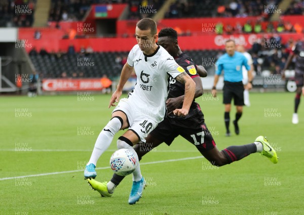 280919 - Swansea City v Reading, SkyBet Championship - Bersant Celina of Swansea City gets past Andy Yiadom of Reading