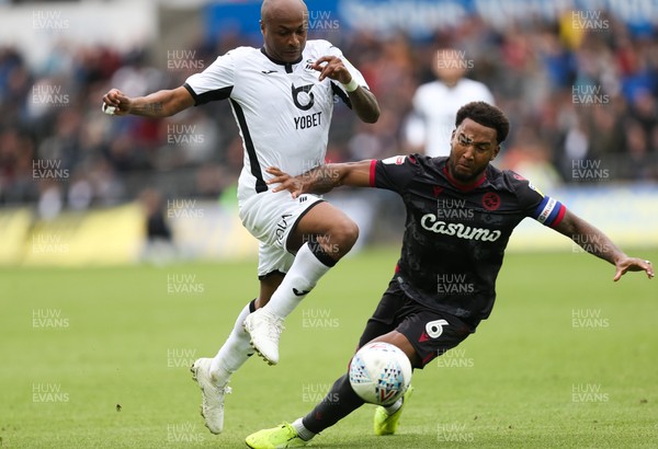 280919 - Swansea City v Reading, SkyBet Championship - Andre Ayew of Swansea City is challenged by Liam Moore of Reading