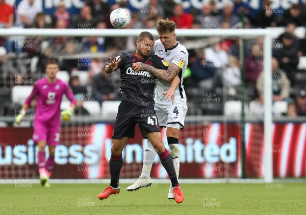 280919 - Swansea City v Reading, SkyBet Championship - George Puscas of Reading and Joe Rodon of Swansea City compete for the ball