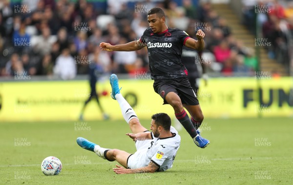 280919 - Swansea City v Reading, SkyBet Championship - Borja Baston of Swansea City is brought down by Andy Rinomhota of Reading