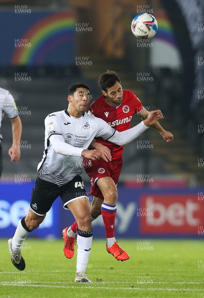 301220 - Swansea City v Reading, Sky Bet Championship - Ben Cabango of Swansea City and Sam Baldock of Reading compete for the ball