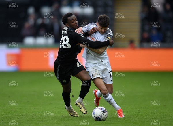 130424 - Swansea City v Rotherham United - Sky Bet Championship - Jamie Paterson of Swansea City is challenged by Sebastian Revan of Rotherham 