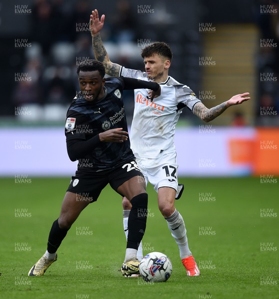130424 - Swansea City v Rotherham United - Sky Bet Championship - Jamie Paterson of Swansea City is challenged by Sebastian Revan of Rotherham 