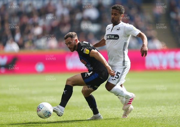 190419 - Swansea City v Rotherham United, Sky Bet Championship - Wayne Routledge of Swansea City and Jon Taylor of Rotherham United compete for the ball