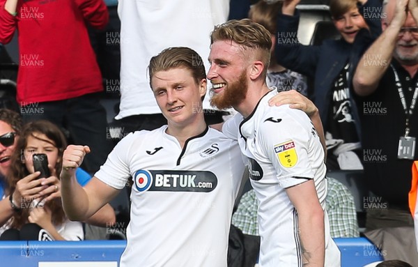 190419 - Swansea City v Rotherham United, Sky Bet Championship - Oli McBurnie of Swansea City, right, celebrates with George Byers of Swansea City after scoring the fourth goal
