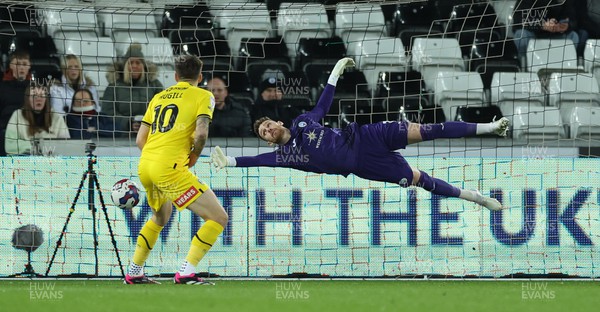 270223 - Swansea City v Rotherham United, EFL Sky Bet Championship - Swansea City goalkeeper Andy Fisher dives to cover a shot at goal