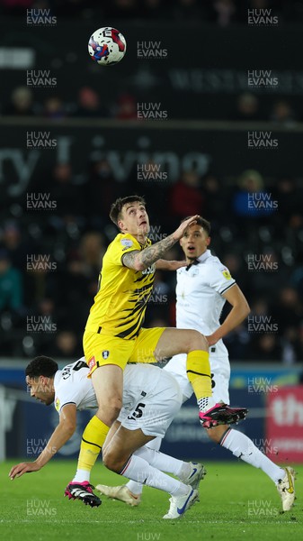 270223 - Swansea City v Rotherham United, EFL Sky Bet Championship - Jordan Hugill of Rotherham and Ben Cabango of Swansea City compete for the ball