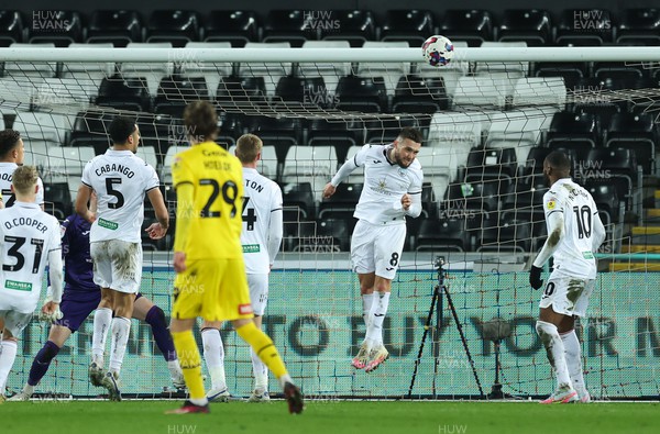 270223 - Swansea City v Rotherham United, EFL Sky Bet Championship - Matt Grimes of Swansea City heads off the line