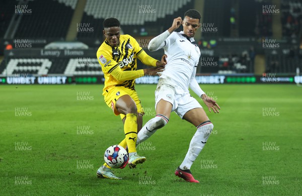 270223 - Swansea City v Rotherham United, EFL Sky Bet Championship - Morgan Whittaker of Swansea City and Chiedozie Ogbene of Rotherham compete for the ball