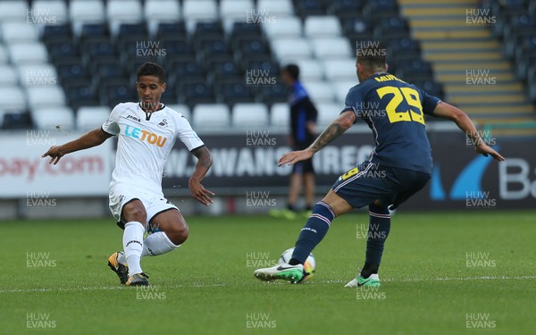 050817 - Swansea City v Sampdoria - Pre Season Friendly - Kyle Naughton of Swansea gets the ball past Nicola Murru of Sampdoria