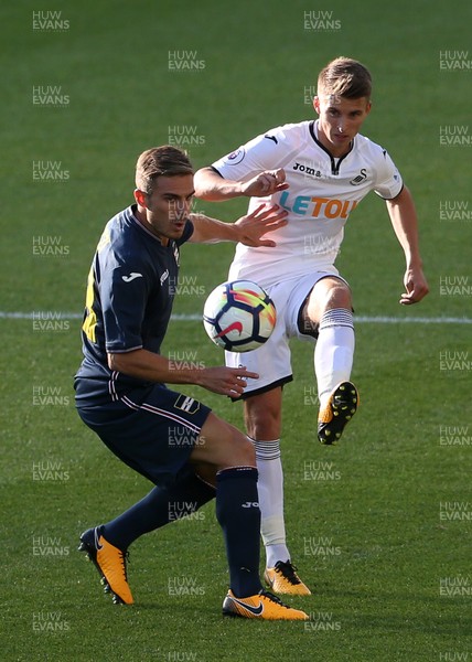 050817 - Swansea City v Sampdoria - Pre Season Friendly - Tom Carroll of Swansea passes the ball past Valerio Verre of Sampdoria