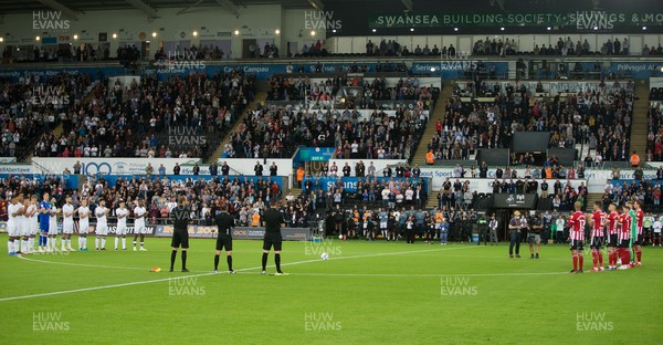 140821 - Swansea City v Sheffield United, EFL Sky Bet Championship - The teams mark a minutes applause at the start of the match in memory of fans who died during the COVID pandemic and to thank NHS staff