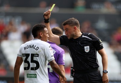 160825 - Swansea City v Sheffield United - SkyBet Championship - Ronald of Swansea City is given a yellow card by referee Thomas Kirk