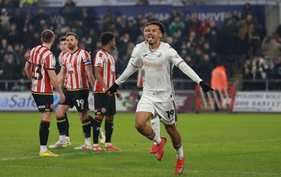 210125  Swansea City v Sheffield United, EFL Sky Bet Championship - Florian Bianchini of Swansea City celebrates after he heads to score the opening goal