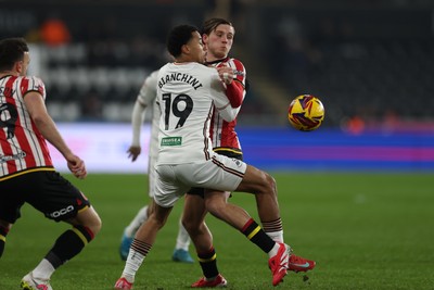 210125  Swansea City v Sheffield United, EFL Sky Bet Championship - Florian Bianchini of Swansea City and Sydie Peck of Sheffield United compete for the ball