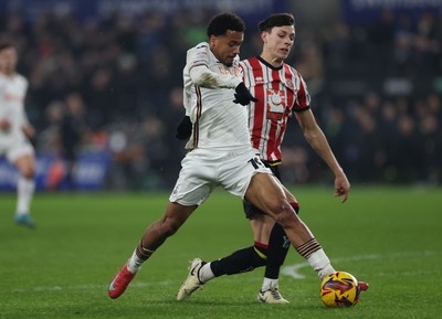 210125  Swansea City v Sheffield United, EFL Sky Bet Championship - Florian Bianchini of Swansea City takes on Anel Ahmedhodzic of Sheffield United