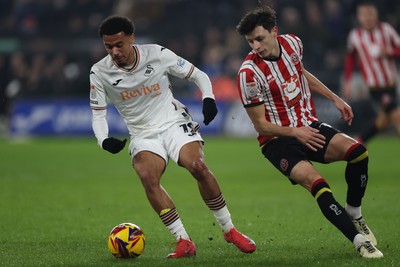 210125  Swansea City v Sheffield United, EFL Sky Bet Championship - Florian Bianchini of Swansea City takes on Anel Ahmedhodzic of Sheffield United