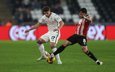 210125  Swansea City v Sheffield United, EFL Sky Bet Championship - Goncalo Franco of Swansea City is challenged by Gustavo Hamer of Sheffield United