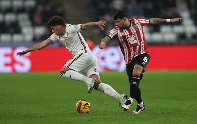 210125  Swansea City v Sheffield United, EFL Sky Bet Championship - Goncalo Franco of Swansea City is challenged by Gustavo Hamer of Sheffield United