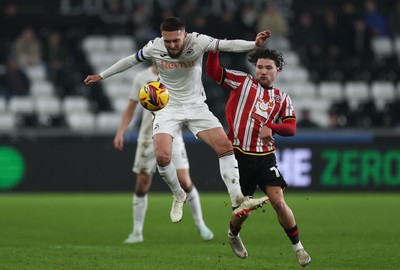 210125  Swansea City v Sheffield United, EFL Sky Bet Championship - Matt Grimes of Swansea City wins the ball from Callum O'Hare of Sheffield United