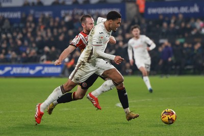 210125  Swansea City v Sheffield United, EFL Sky Bet Championship - Myles Peart-Harris of Swansea City is challenged by Rhys Norrington-Davies of Sheffield United