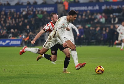 210125  Swansea City v Sheffield United, EFL Sky Bet Championship - Myles Peart-Harris of Swansea City is challenged by Rhys Norrington-Davies of Sheffield United