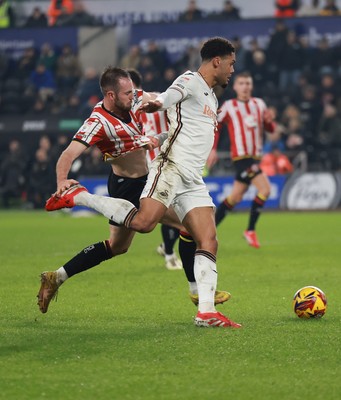 210125  Swansea City v Sheffield United, EFL Sky Bet Championship - Myles Peart-Harris of Swansea City is challenged by Rhys Norrington-Davies of Sheffield United